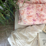 Naturally Dyed Silk Pillowcase Orange and Pink on bed